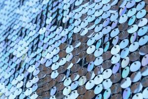 abstract background of silver disks suspended on strings. sparkling photo