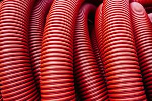 red corrugated pvc pipe for underground electrical cable laying photo