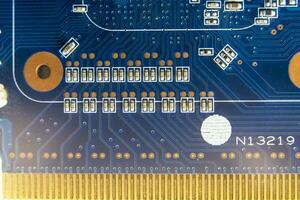 resistors on the blue printed circuit board. pcb photo