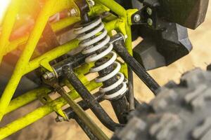 elements of the front suspension of the ATV close-up photo