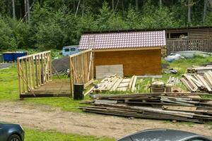 construction of a frame house. Timber frame house, new build roof photo