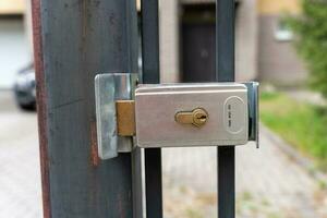 metal mortise lock on a metal door. entrance to the private territory photo