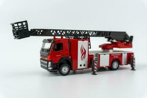 toy fire truck on a white background. Emergency vehicle. photo