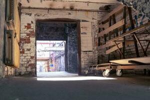 old arch on the territory of old factory. gallery on territory of port photo