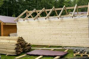 construction of a frame house. Timber frame house, new build roof photo