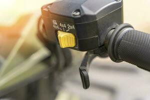 atv controls close-up. switches on the handlebar of the ATV photo