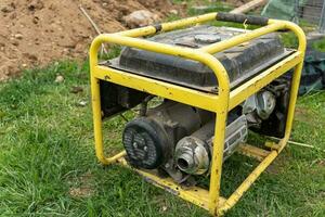 portable gasoline generator operating on a construction site photo