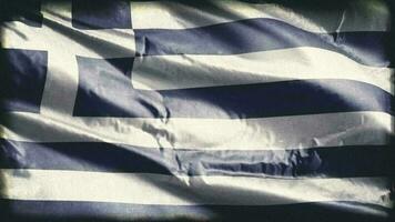 Retro aged Greece flag waving on the wind. Old vintage Greek banner swaying on the breeze. Seamless loop. video