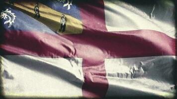 Retro aged Herm flag waving on the wind. Old vintage banner swaying on the breeze. Seamless loop. video