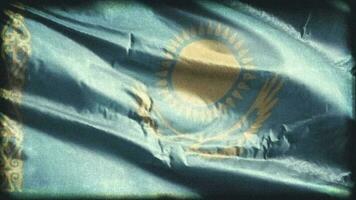 Retro aged Kazakhstan flag waving on the wind. Old vintage Kazakh banner swaying on the breeze. Seamless loop. video