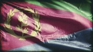 Retro aged Eritrea flag waving on the wind. Old vintage Eritrean banner swaying on the breeze. Seamless loop. video