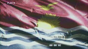 VHS video casette record Kiribati flag waving on the wind. Glitch noise with time counter recording Kiribat banner swaying on the breeze. Seamless loop.