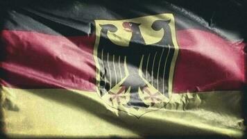 Retro aged Germany flag waving on the wind. Old vintage German banner swaying on the breeze. Seamless loop. video