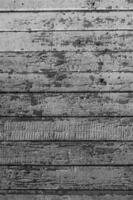 an old wooden background made of boards with peeling paint of vertical photo