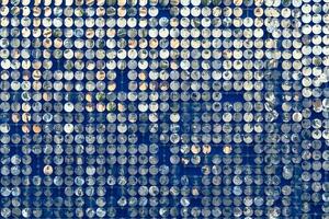 abstract background of silver disks suspended on strings. sparkling photo