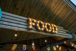 the glowing street sign of the FOOD street cafe photo