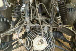 the front part of a broken and disassembled ATV in need of repair photo