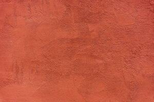 Abstract background of red textured plaster photo