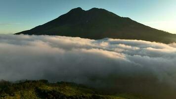 Aerial View of Mount Lawu Above the Clouds at Sunrise, Indonesia video