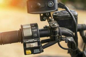 atv controls close-up. switches on the handlebar of the ATV photo