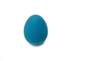 Colorful easter egg. The blue egg is isolated on a white background photo