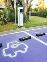 Charging point for electric vehicles in urban street. photo