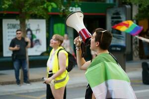 Granada, Spain. June 26, 2023. Diversity of people at LGBTQ Pride demonstration photo