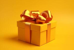 Gift box with golden satin ribbon and bow on yellow background. Holiday gift with copy space. photo