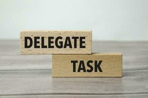 delegate task on the work table and alarm clock photo