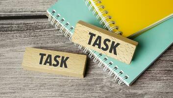 task symbol. Concept words return on assets on wooden blocks. photo