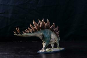 Dinosaur stegosaurus in the dark photo