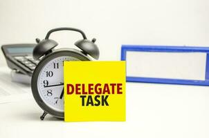 Retro alarm clock and the text delegate task word photo