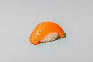 Sushi with salmon isolated on grey background, close up, copy space photo