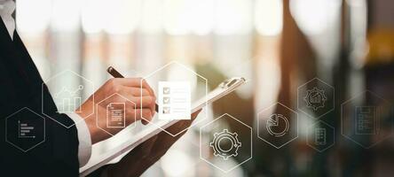 Accountant showing office document auditing concept ,plan review process and assess correctness ,Management of important document storage of organization ,document system ,accountant Audit documents photo