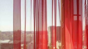 Red transparent voile at the window video