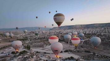 Cappadocia, Turkey - October 30, 2022,  Balloons Take Off At Dawn Over Cappadocia, Aerial View video