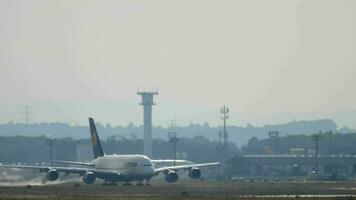 FRANKFURT AM MAIN, GERMANY JULY 17, 2017 - Huge double deck four engine passenger Airbus A380 of Lufthansa taking off at Frankfurt am Main airport, long shot. Tourism and travel concept. video