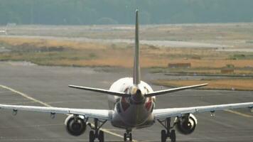 Rear view, unrecognizable passenger aircraft set speed to take off. Airfield on a hot day. Haze over the runway. Tourism and travel concept. video