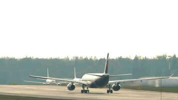 MOSCOW, RUSSIAN FEDERATION JULY 30, 2021 - Rear view of Airbus A330 of Aeroflot speed up before takeoff. Tourism and travel concept video