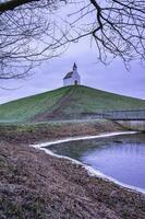 White little church on top of  the hill, De Terp Leidsenveen The Hague The Netherlands photo