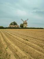 Moulin de pierre, old windmill in Hauville, France. photo