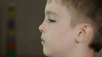 Eyes of a seven years old boy. Closeup video