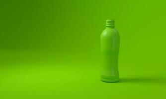 plastic bottle in a green studio background. concept of recycling and reuse of plastics. photo