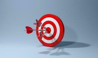 Red dart with arrow hitting target on blue background. Business aiming at the target concept. photo