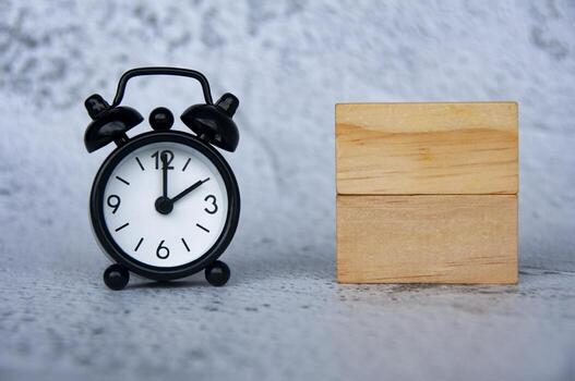 Alarm clock with wooden blocks with customizable space for text. Copy space photo