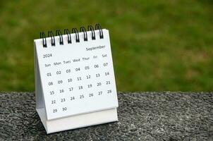 September 2024 table calendar with customizable space for text. Calendar concept and copy space. photo