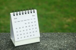 May 2024 table calendar with customizable space for text. Calendar concept and copy space. photo