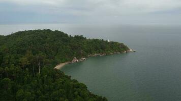 Aerial view white light house at forest in Pulau Rimau video