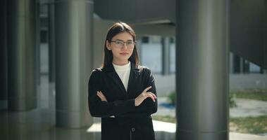 Portrait of Young woman dressed in formal business standing in workplace. photo