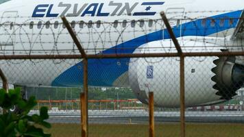 PHUKET, THAILAND JANUARY 31, 2023 - Plane Boeing 787 of El Al taxiing on the runway. Plane is preparing for takeoff moving along runway video